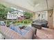 Inviting screened porch with comfortable seating and views of the backyard at 6647 Gaywind Dr, Charlotte, NC 28226