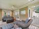 Relaxing screened porch with ceiling fan and view of the outdoor living space at 6647 Gaywind Dr, Charlotte, NC 28226