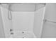 Clean white bathtub shower with a shower head and white tile walls at 6705 E Douglas Park Dr, Huntersville, NC 28078