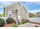 Charming home exterior featuring a back entrance with stairs and well-maintained yard at 6705 E Douglas Park Dr, Huntersville, NC 28078