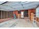 Spacious garage interior with exposed brick and wooden frames at 6705 E Douglas Park Dr, Huntersville, NC 28078
