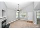 Bright living room with a fireplace, lots of natural light, and a welcoming atmosphere at 6705 E Douglas Park Dr, Huntersville, NC 28078