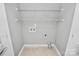 A storage room with shelves and connections for laundry machines at 6705 E Douglas Park Dr, Huntersville, NC 28078