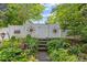Tranquil backyard garden with a white fence, beautiful landscaping, and decorative accents, a true outdoor escape at 6827 Dunton St, Huntersville, NC 28078