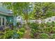 Inviting backyard with a seating area, lush landscaping, and a well-manicured garden, perfect for entertaining at 6827 Dunton St, Huntersville, NC 28078