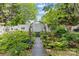 Serene backyard garden featuring an archway and lush greenery, creating a private outdoor oasis at 6827 Dunton St, Huntersville, NC 28078