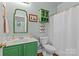 Well-maintained bathroom featuring a shower and a colorful vanity with sink at 6827 Dunton St, Huntersville, NC 28078