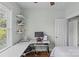Bedroom featuring a desk area with computer setup, decorated walls and shelves, and ample natural light at 6827 Dunton St, Huntersville, NC 28078