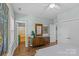 Bright bedroom featuring hardwood floors, large windows, and ample storage space at 6827 Dunton St, Huntersville, NC 28078
