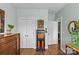 Bedroom showcasing a dresser, closet, and doorway, complemented by light-colored walls and hardwood floors at 6827 Dunton St, Huntersville, NC 28078