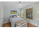 Cozy bedroom with hardwood floors, soft natural light, and tasteful decor at 6827 Dunton St, Huntersville, NC 28078