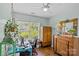 Bright bedroom space with hardwood flooring, ceiling fan, natural lighting, and decorative furnishings at 6827 Dunton St, Huntersville, NC 28078