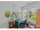 Bedroom featuring a desk area with computer setup, decorated walls and shelves, and ample natural light at 6827 Dunton St, Huntersville, NC 28078