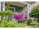 Close-up of purple foxglove flowers with home exterior in the background at 6827 Dunton St, Huntersville, NC 28078