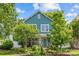 Charming two-story home featuring a landscaped yard and inviting curb appeal on a beautiful sunny day at 6827 Dunton St, Huntersville, NC 28078