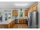 A well-lit kitchen featuring stainless steel appliances and light wood cabinets at 6827 Dunton St, Huntersville, NC 28078