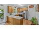 Bright kitchen featuring stainless appliances and wooden cabinets and hard wood floors at 6827 Dunton St, Huntersville, NC 28078