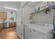 Functional laundry room with washer, dryer, and storage shelves at 6827 Dunton St, Huntersville, NC 28078