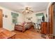 Comfortable bedroom with wood floors, ceiling fan, and dresser at 6934 Lockhart Rd, Sharon, SC 29742