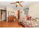 Bedroom with wood floors, neutral walls, and adjoining bathroom at 6934 Lockhart Rd, Sharon, SC 29742