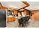 Functional kitchen with an island, wood cabinetry, and seamlessly flowing into an adjacent living space at 6934 Lockhart Rd, Sharon, SC 29742
