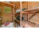 Small outdoor storage shed with shelving and a window at 6934 Lockhart Rd, Sharon, SC 29742