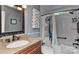 Charming bathroom with a classic vanity, framed mirror, and tiled shower-tub combination with a curtain at 705 Moss Creek Dr, Matthews, NC 28105