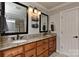 Bathroom featuring double sinks, granite countertops, and modern fixtures at 705 Moss Creek Dr, Matthews, NC 28105