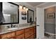 Bright bathroom features a double sink vanity with granite countertops and a separate toilet room at 705 Moss Creek Dr, Matthews, NC 28105