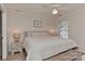 Cozy bedroom with a comfortable queen-size bed, ceiling fan, and a window allowing natural light at 705 Moss Creek Dr, Matthews, NC 28105