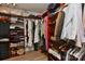 Spacious walk-in closet with custom built-in shelving and ample storage space for clothes and accessories at 705 Moss Creek Dr, Matthews, NC 28105