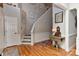 Welcoming foyer with hardwood floors, staircase, and elegant decor at 705 Moss Creek Dr, Matthews, NC 28105