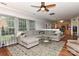 Open living room featuring hardwood floors, natural light, and a seamless flow to the kitchen at 705 Moss Creek Dr, Matthews, NC 28105