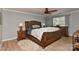 Comfortable bedroom featuring a large bed, ceiling fan, and natural light at 705 Moss Creek Dr, Matthews, NC 28105