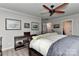 Cozy bedroom with neutral walls, ceiling fan, and stylish decor at 705 Moss Creek Dr, Matthews, NC 28105