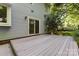 Spacious backyard deck with sliding glass door access to the home's interior at 7226 Reedy Creek Rd, Charlotte, NC 28215