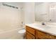 Bathroom with tub and shower combo with marble countertop and tiled floors at 7226 Reedy Creek Rd, Charlotte, NC 28215