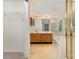 Large bathroom with double sinks, tile flooring, and a separate shower at 7226 Reedy Creek Rd, Charlotte, NC 28215