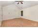 Bright bedroom featuring a vaulted ceiling and natural light at 7226 Reedy Creek Rd, Charlotte, NC 28215