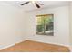 Bedroom with neutral walls, modern ceiling fan and hardwood flooring with natural light at 7226 Reedy Creek Rd, Charlotte, NC 28215