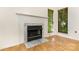 Close-up of a fireplace with marble surround and decorative molding at 7226 Reedy Creek Rd, Charlotte, NC 28215