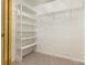 Spacious walk-in closet featuring built-in shelving for optimal storage and organization at 7226 Reedy Creek Rd, Charlotte, NC 28215