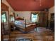 View of spacious bedroom with hardwood floors and rustic wood furniture at 850 Meadowbend Dr, York, SC 29745