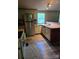 Open kitchen with stainless steel refrigerator, neutral cabinets, butcher block counters, and durable flooring at 850 Meadowbend Dr, York, SC 29745