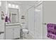Bright bathroom featuring a glass-enclosed shower, granite-topped vanity, and white fixtures, with neutral wall color at 9750 Briarwick Ln, Charlotte, NC 28277