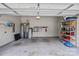 Clean and organized two-car garage featuring ample storage shelves and neutral paint at 9750 Briarwick Ln, Charlotte, NC 28277