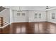 Spacious living room with hardwood floors, recessed lighting, and multiple windows providing natural light at 9750 Briarwick Ln, Charlotte, NC 28277