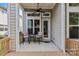 Cozy covered porch featuring outdoor seating, perfect for enjoying the outdoors at 9750 Briarwick Ln, Charlotte, NC 28277