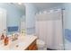 Bright bathroom featuring a combination tub and shower with a modern vanity at 10322 Stoneykirk Ln, Charlotte, NC 28269