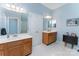 Bathroom with double sink vanity and a large window providing natural light at 10322 Stoneykirk Ln, Charlotte, NC 28269